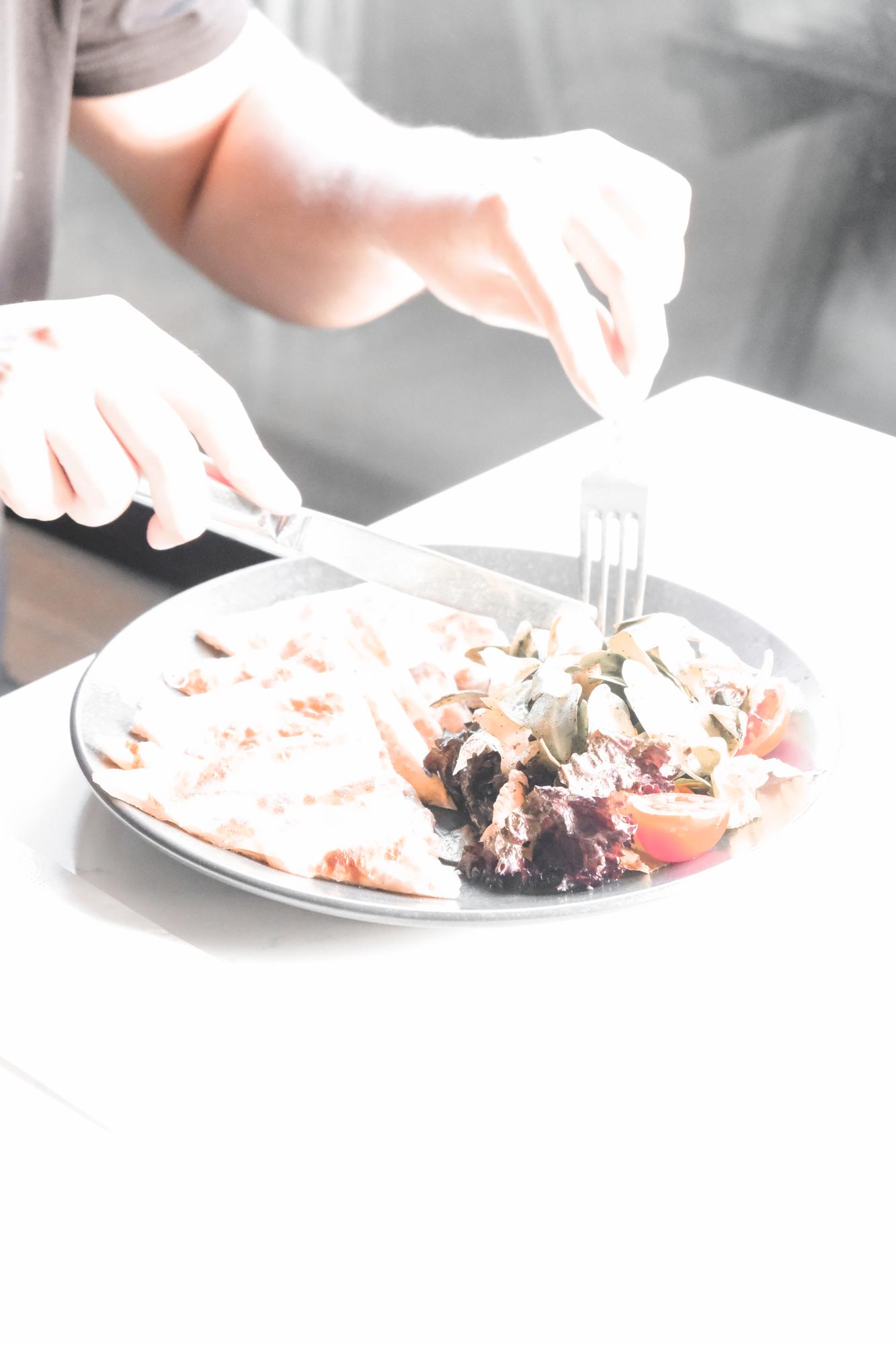 Chef hands plating a quick weekday dinner