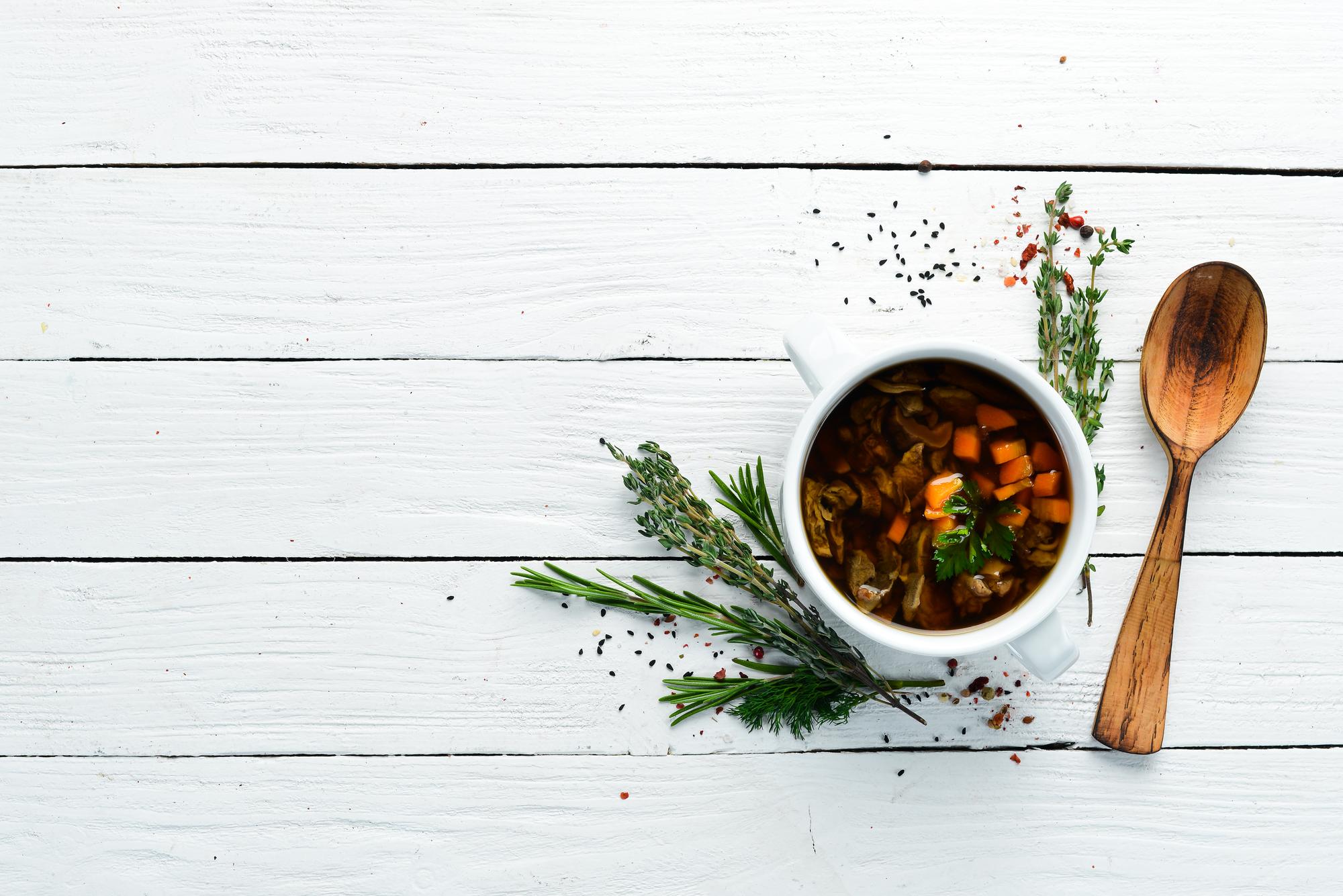 Bowl of warm seasonal stew on wooden table